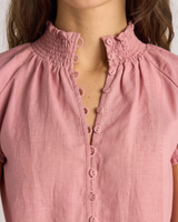 House of Holabox Lani shirred blouse in dusty rose featuring a smocked collar and button-front detail in linen blend.