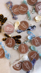Saltist colourful acrylic spoons and butter knives in various marbled patterns with branded circular tags.