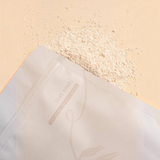 House of Holabox cle. naturals Relief organic colloidal oat soak in a resealable pouch with loose powder on beige.