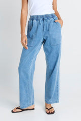 Quinn Cotton Jogger in mid-blue denim featuring an elasticated drawstring waistband and functional front pockets.