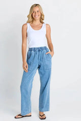 Model wearing Quinn Cotton Joggers in light blue denim with a comfortable elasticated waistband and side pockets.