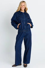 Model wearing dark blue Goldie Jeans with a comfortable easy leg shape and functional pockets.