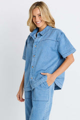 Quinn cotton shirt in light blue denim featuring a relaxed silhouette and a button-through front.