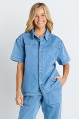 Quinn cotton shirt in mid-blue denim with a relaxed silhouette and button-through front.