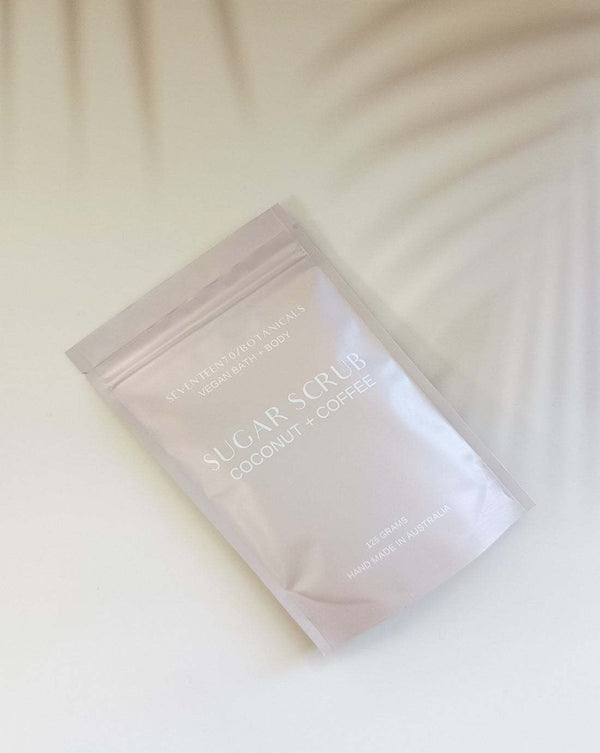 Sugar scrub packaging with coconut and coffee ingredients on a white background