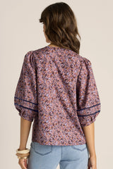 Alaia print cotton blouse with voluminous elbow-length sleeves and delicate lace insert detailing.