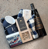 Campfire Boss Father's Day gift box with navy enamel mugs, marshmallows, pistachios, tea towel, matches, and choice of Shiraz or lager