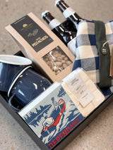 Campfire Boss Father's Day gift box with navy mugs, marshmallows, pistachios, tea towel, matches, and wine or lager