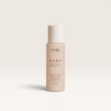 Stray Willow baby bath and massage oil in a beige bottle with a white cap and minimalist label