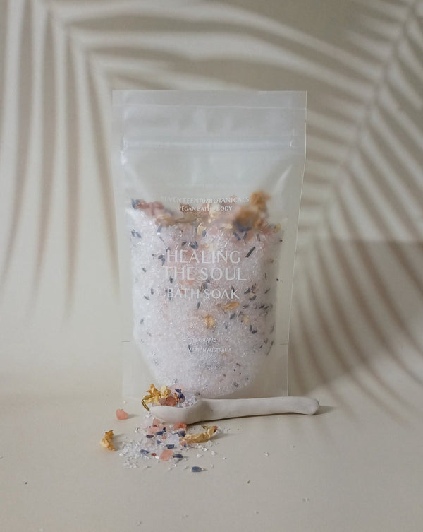 Bath salt package labeled 'Healing the Soul' with a wooden spoon on a neutral background