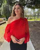 Red one-shoulder viscose top featuring a sculptural floral appliqué and voluminous long sleeves with gathered details.