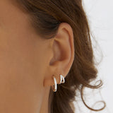 ‘Arms Of Eve’ Jean Silver Huggie Earrings