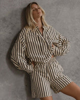 Woman wearing oversized striped Rohan Shirt with dropped shoulders and self fabric belt