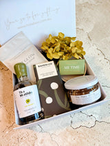 Vodka and Lime Mother's Day gift box with premium vodka, lime garnish, chocolate, body scrub, and floral arrangement
