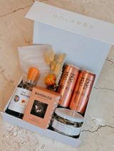 The Gin Mother luxury Mother's Day gift box with gin, tonic waters, lime, body scrub, and chocolate nougat