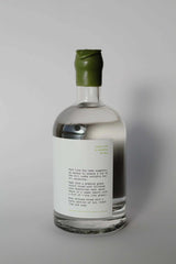 The Maltilda Distilling Company The Plains Vodka bottle on a summer day with mangoes and hammock background