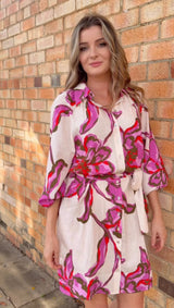 Novara Linen Dress with exclusive print, button-through front, removable waist tie, and side pockets
