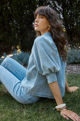 Lila Denim Balloon Shirt in soft washed blue denim featuring voluminous puff sleeves, worn with matching jeans.