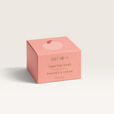 House of Holabox Stray Willow Peaches & Cream sugar lip scrub in a peach-coloured square box with gold lettering.