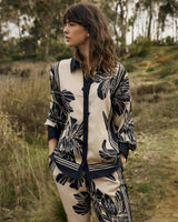 June Collared Shirt in a beige and navy floral print with contrast trim, classic collar, and relaxed lyocell fit.