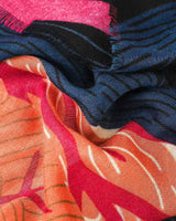 Chloe abstract forest scarf in black with pink, green and navy tones and lightly frayed edges.