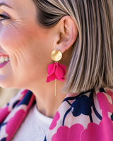 Olivia matte gold and hot pink flower petal dangle earrings featuring a layered floral design on a woman.