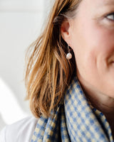 Sarah Freshwater Pearl Earrings featuring a small sterling silver sleeper hoop with a delicate pearl drop.