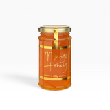 House of Holabox Ogilvie & Co 300g jar of golden mango-infused honey with elegant gold label and lid
