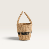 House of Holabox Wicka Positano Bambini mini seagrass tote basket with black woven detail on a white background.