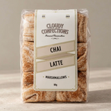 Cloudy Confections chai latte marshmallows, soft square pieces dusted with brown chai spice in clear packaging.