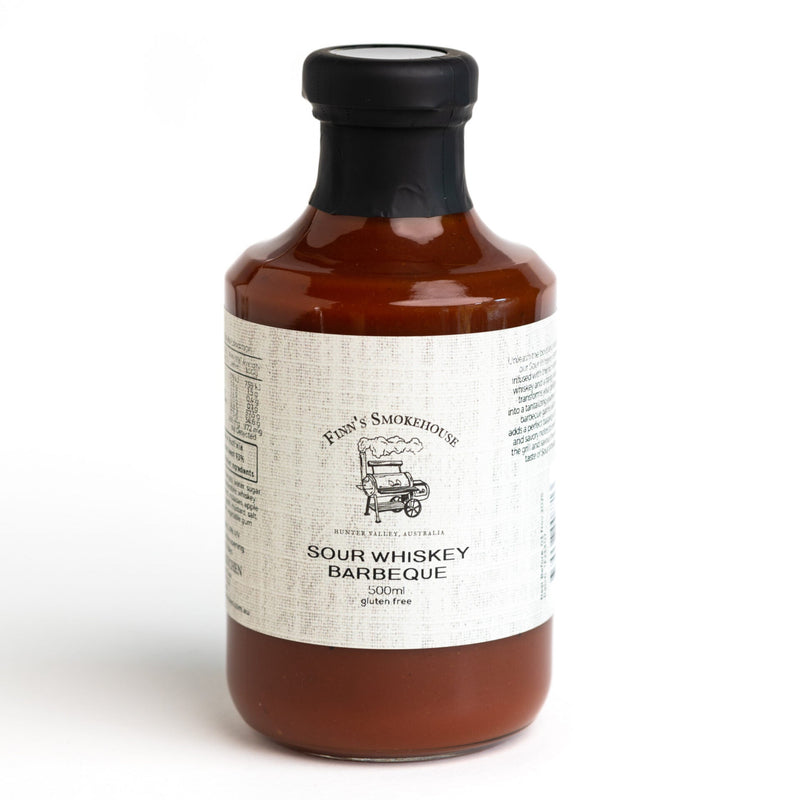 Bottle of sour whiskey barbecue sauce on a white background