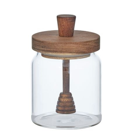 Clear glass jar with a wooden lid and handle on a white background
