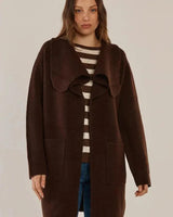Dark brown open-front cardigan jacket in soft stretch knit with a wide collar, ribbed cuffs, and front pockets.