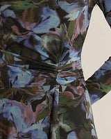 Fitted blue mesh dress with an abstract floral print and soft side-waist gathering.