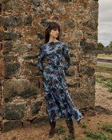 Alix mesh midi dress in blue blurred floral print with a boat neckline and gathered skirt detail.
