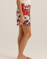 Side view of red viscose-linen blend shorts featuring a bold floral print, flat front, and side pockets.