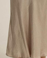 Taupe midi skirt in smooth satin with a flattering bias cut silhouette and elegant drape.