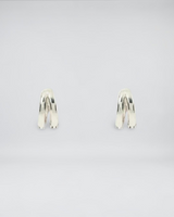 House of Holabox Arms Of Eve Jean silver huggie earrings featuring a sleek double-hoop design in rhodium-plated silver.