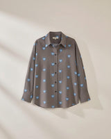 Athena cotton shirt in brown with a blue floral stripe pattern, collared neckline, and button-through front.