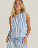 Blue and white striped sleeveless top with adjustable tie sides and asymmetric gathering at the bust.
