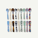 Saltist colourful acrylic spoon and butter knife set in assorted marbled patterns for stylish hosting and dining.