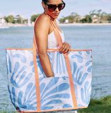 Assorted jumbo beach bags with shoulder straps and waterproof design for beach and picnic use