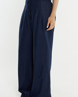 Navy tailored wide-leg pants in a viscose-linen blend, featuring a thin waist tie and side pockets.