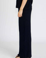 Side view of Bonnie pants in a deep navy cotton viscose blend with a comfortable, relaxed wide-leg fit.