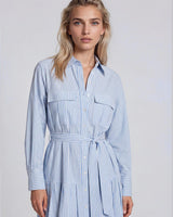 Blue and white striped cotton shirt dress with chest pockets, button front, and a self-fabric waist tie.