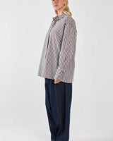 Relaxed-fit striped shirt with dropped shoulders, wide cuffs, and a concealed placket in a cotton-nylon blend.