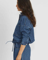 Cleo cropped denim jacket in blue leopard print with a drawstring waist and buttoned cuffs.