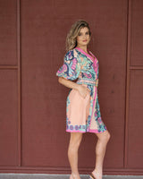 Dali mini dress in Cali Pink featuring a V-neck, button-up front, puff sleeves, and a detachable belt in linen blend.