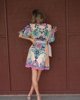 Cali Pink Dali mini dress featuring a floral print, detachable belt, and puffed sleeves in a linen-blend fabric.