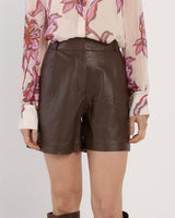 High-rise dark brown genuine leather shorts with a tailored fit and clean, structured silhouette.
